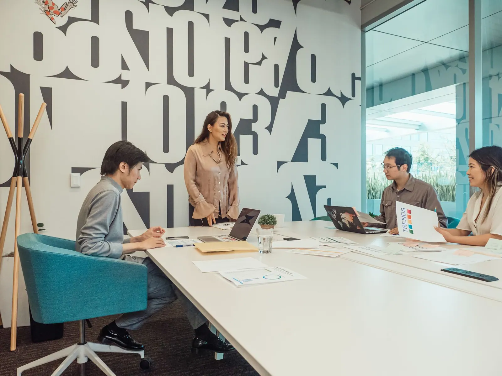 Diverse team engaged in brainstorming session in a modern office space.
